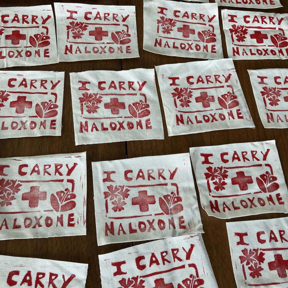 Block print of the phrase I Carry Naloxone.